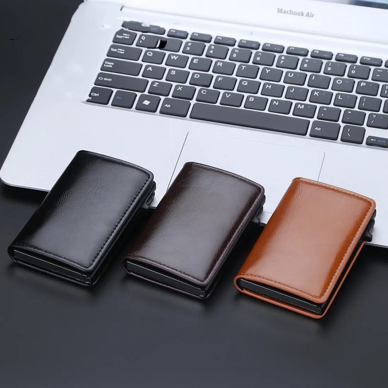 Slim pop up aluminium card holder with a leather cover