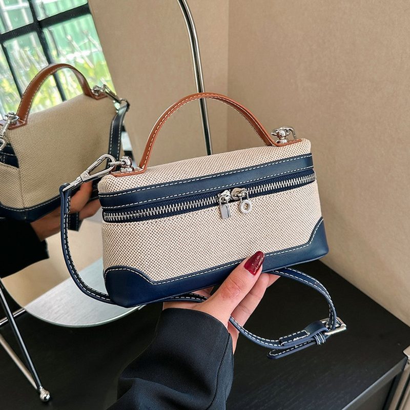 Canvas and navy two-tone top handle bag