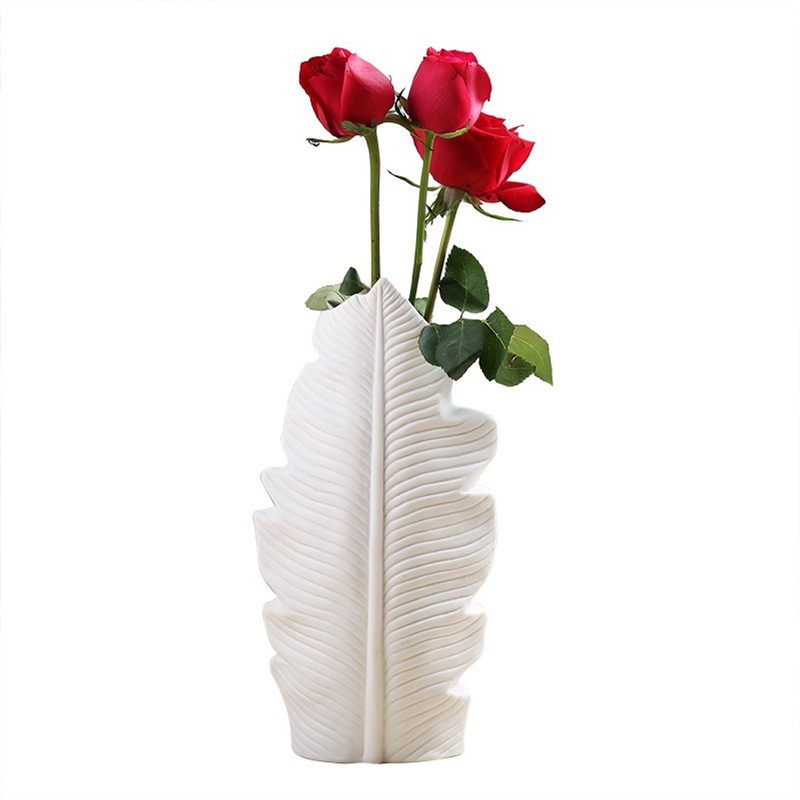 white leaf shaped ceramic vase