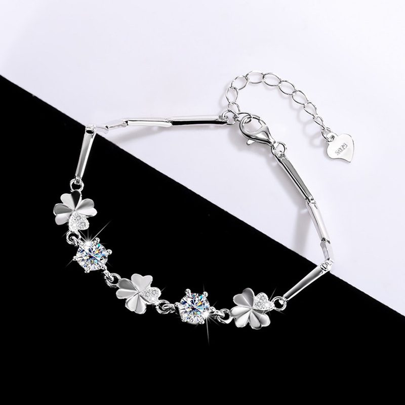 Silver four-leaf clover bracelet with clear stones