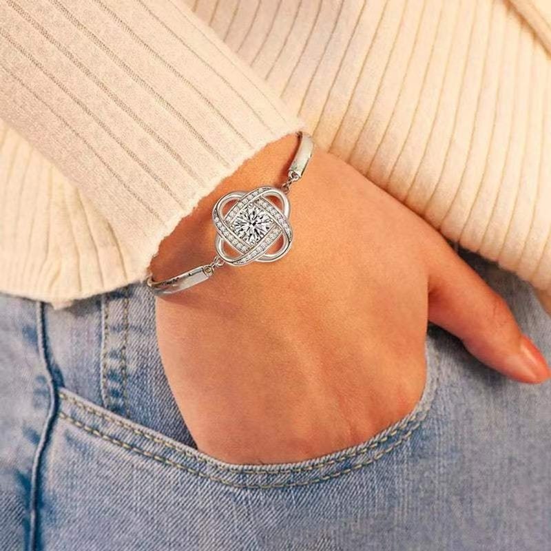 Delicate clover charm bracelet on the wrist