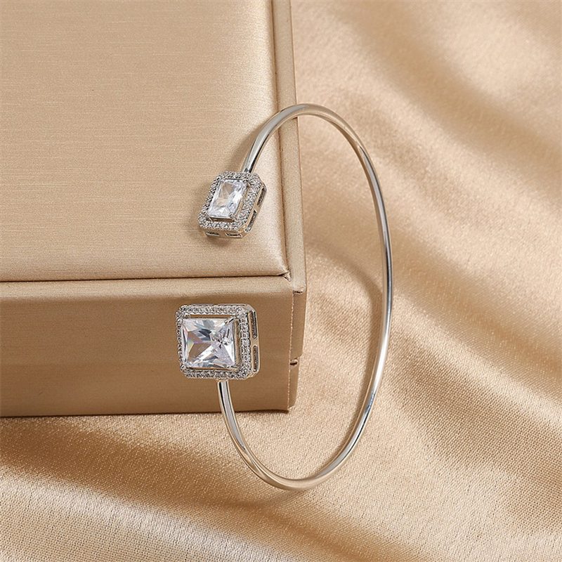 Slim silver bangle with two square clear crystals