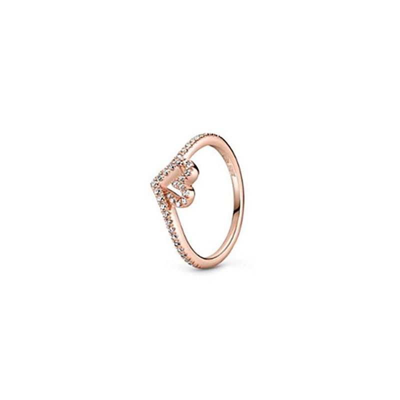 Rose-tone solitaire ring with a single clear stone
