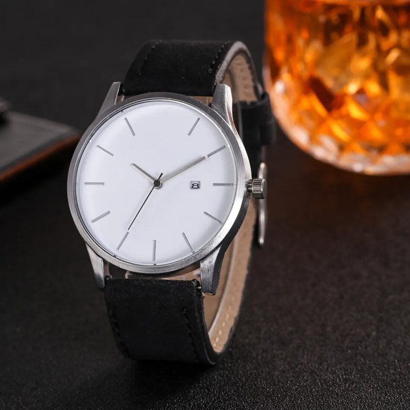 Minimalist white-dial watch with a date window on a leather strap