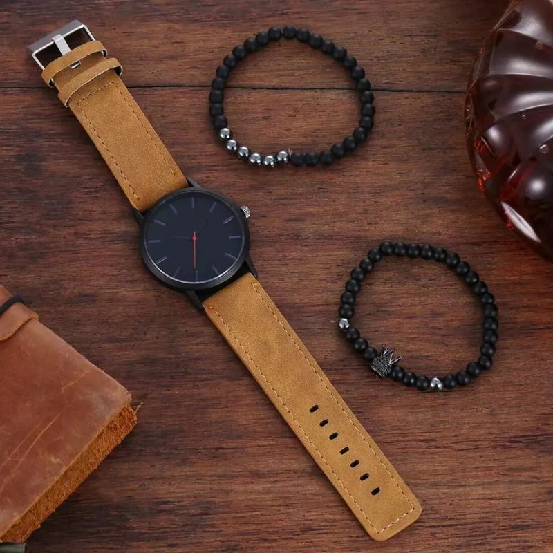 Minimalist black-dial watch on a tan leather strap